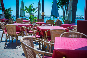 Sun terraces for tourists in summer in Marbella, Malaga, Spain