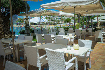 Empty tables, Resort, Sun terraces for tourists in summer in Marbella, Malaga, Spain