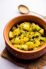 Lauki/doodhi ki sookhi Sabji also known as bottle gourd dry vegetable recipe. served in a bowl or karahi. selective focus