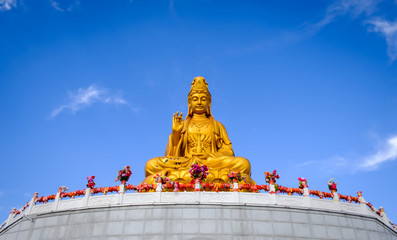 Sitting statue of The Goddess of Compassion and Mercy