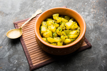 Lauki/doodhi ki sookhi Sabji also known as bottle gourd dry vegetable recipe. served in a bowl or karahi. selective focus