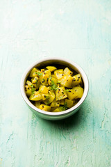 Lauki/doodhi ki sookhi Sabji also known as bottle gourd dry vegetable recipe. served in a bowl or karahi. selective focus
