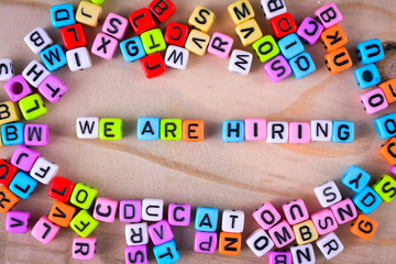 Cube dices with word We are Hiring