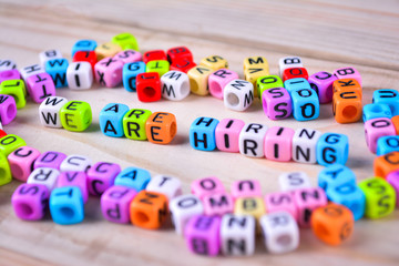 Cube dices with word We are Hiring