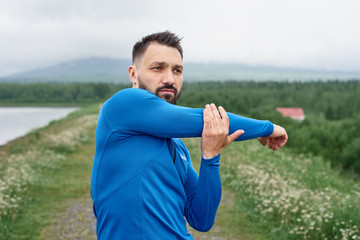 Fototapeta premium Man exercising outdoor on gloomy day