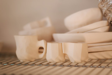 Fototapeta na wymiar Dishes made of ceramics. Cups, mugs and cutlery