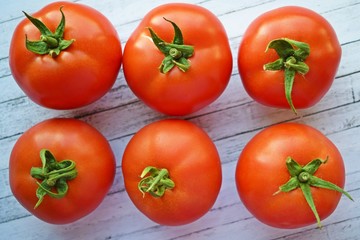 Delicious,ripe tomatoes on a wooden background.Healthy diet.