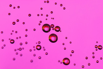 beautiful vials of air in water on a multi-colored background.The texture of water on the glass