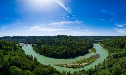 A river with a little idyllic island as a panorama.