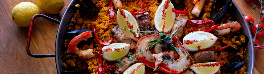 Delicious Spanish seafood paella, view from top panoramic image
