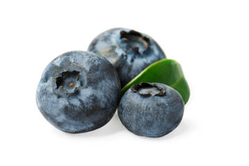 Fresh blueberries with green leaf isolated on white background