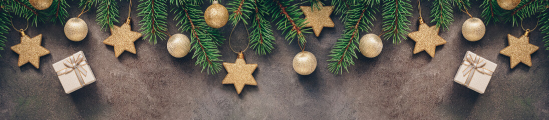Christmas festive border, branch fir decorated with golden balls and stars, gift box, dark rustic...
