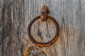 iron ring on a wooden boards background