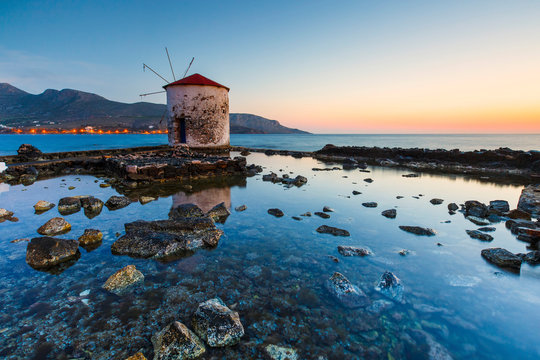 Sunrise landscape with a windmill in Agia Marina village on Leros.