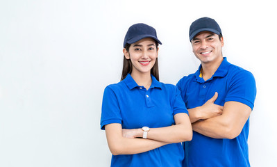 Portrait of smart happy delivery couple man woman isolated on white background, Young asian team wearing blue uniform. Delivery business teamwork concept - obrazy, fototapety, plakaty