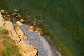 Wild sea coast, wave and hill - beautiful summer landscape and travel concept, bright day and sky with clouds