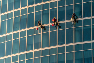 The window washers on the skyscrapers at work,