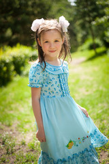 cute little girl having fun walking in a Sunny Park