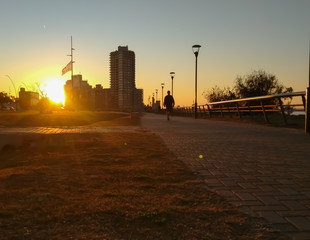 People enjoy the sunset at the north harbor in Rosario, Argentina