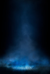 Empty street scene background with abstract spotlights light. Night view of street light reflected on water. Rays through the fog. Smoke, fog, wet asphalt with reflection of lights. 