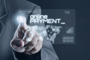 Obraz premium Business man pointing to virtual screen. Business & Technology Concept