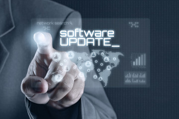 Obraz premium Business man pointing to virtual screen. Business & Technology Concept