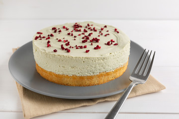 Matcha green tea cheesecake on white background