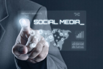 Business man pointing to virtual screen. Business & Technology Concept