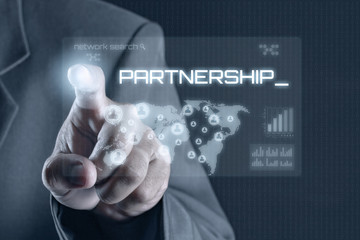 Obraz premium Business man pointing to virtual screen. Business & Technology Concept