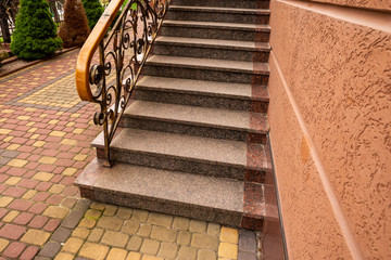 granite steps with wrought iron with handrails