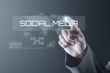 Business man pointing to social media network icons structure