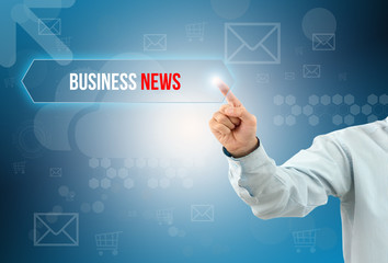 business man touch a button on an imaginary screen with text BUSINESS NEWS