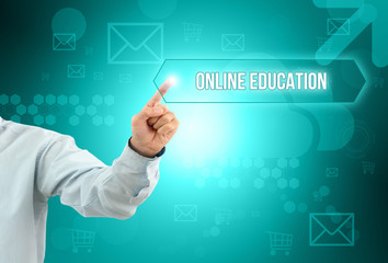 Business man touch a button on an imaginary screen. ONLINE EDUCATION CONCEPT
