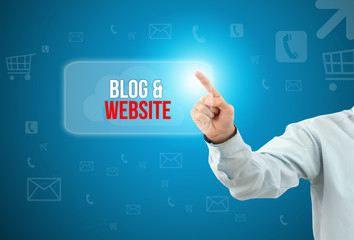 Business man touch a button on an imaginary screen with text BLOG & WEBSITE