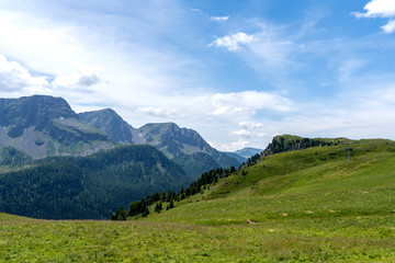 Fototapeta na wymiar San Pellegrino Pass, Moena , Trentino Alto Adige, Alps, Dolomites, Italy: Landscape at the San Pellegrino Pass (1918 m).It's a high mountain pass in the Italian Dolomites. Summer landscape in the Alps