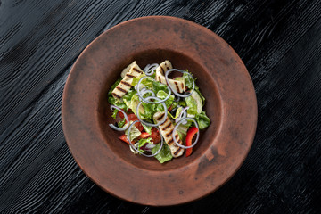 Fresh salad with grilled cheese, tomatoes, olives, lettuce and arugula-2.