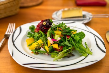 Vegetable salad on wooden table.