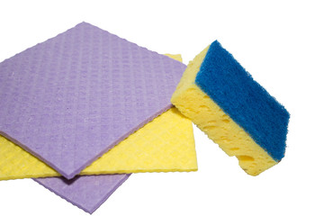 Accessories for cleaning washcloth on a white background. Yellow and purple dishcloths and cleaning