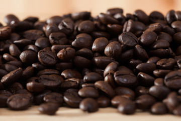 Obraz premium Image of fresh coffee beans on natural wooden background