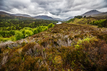 Beautiful scenic landscape of Scotland nature with beautiful evening cloudy sky.