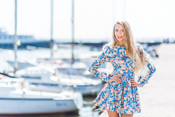 Nice women with flowers near the boat feals happy