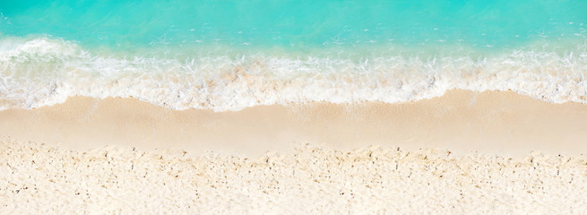 Fototapeta na wymiar Waves on the sand beach sea edge view from