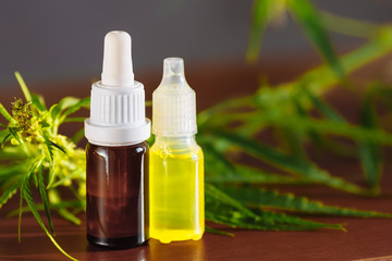 Bottle of CBD cannabis oil. Health marijuana with cannabidiol content. Pharmaceutical hemp drug preparation with safe cannabinoids