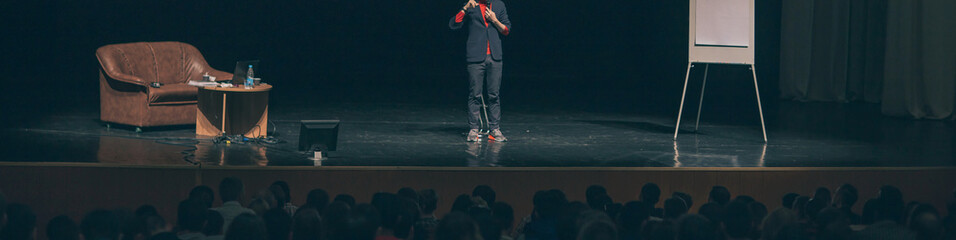 cropped image .lecturer standing on the podium during a business conference.