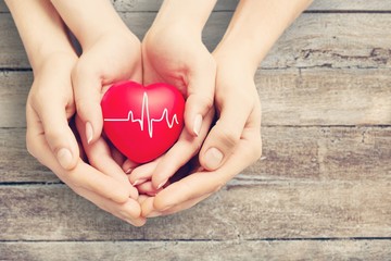 Close-up red Heart in hands, love concept