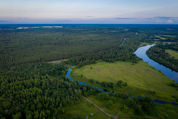 aerial landscape of winding river Klyazma in green field, top view of beautiful nature texture from drone/ Vladimir city Russia