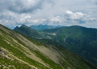 View from Banikov peak on Western Tatra mountains ridge or Rohace panorama. Sharp green mountains -...