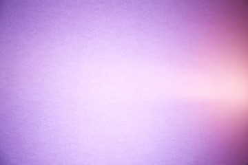 A light pink ray of light cuts through a purple and lilac brutish textural background