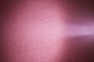 A light purple ray of light cuts through a deep pink textural cloud of light