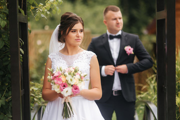 Happy groom and bride smile and have fun. Wedding day